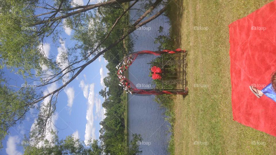 black, red, Wedding arch, outside, summer, pond, lace, bows, ribbons