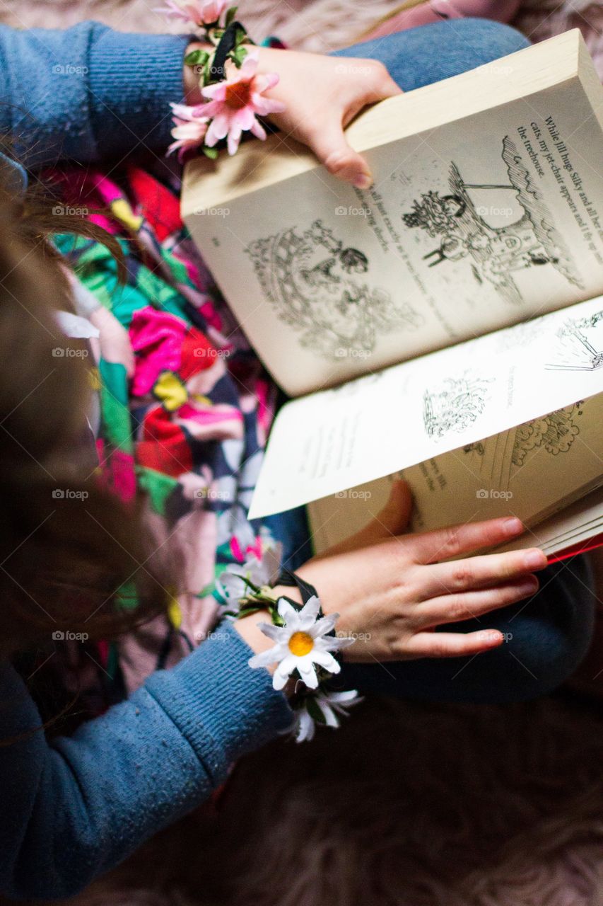 An important part of my day is to read with my daughter. Love spending time with her. Image of girl reading a book.