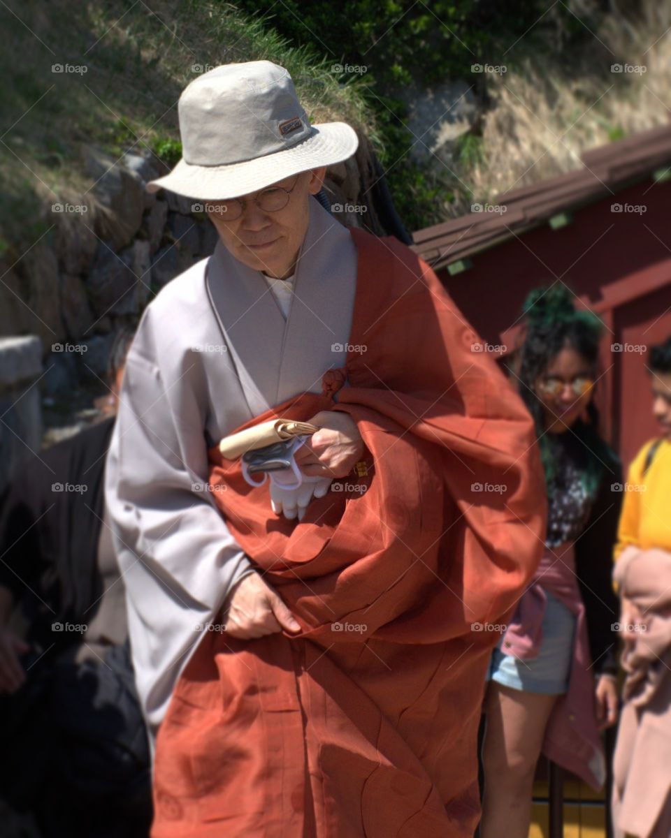 Gray and saffron are the colors of choice for Theravada Buddhist followers in Southeast Asia. Gray gowns are traditionally dyed with charcoal powder. Gray means harmony and also reminds the monks of the fact that after death their body will be burned and will become gray ashes.