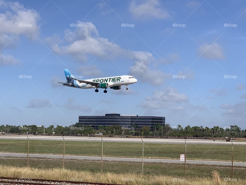 Frontier Airlines landing at Miami International Airport 