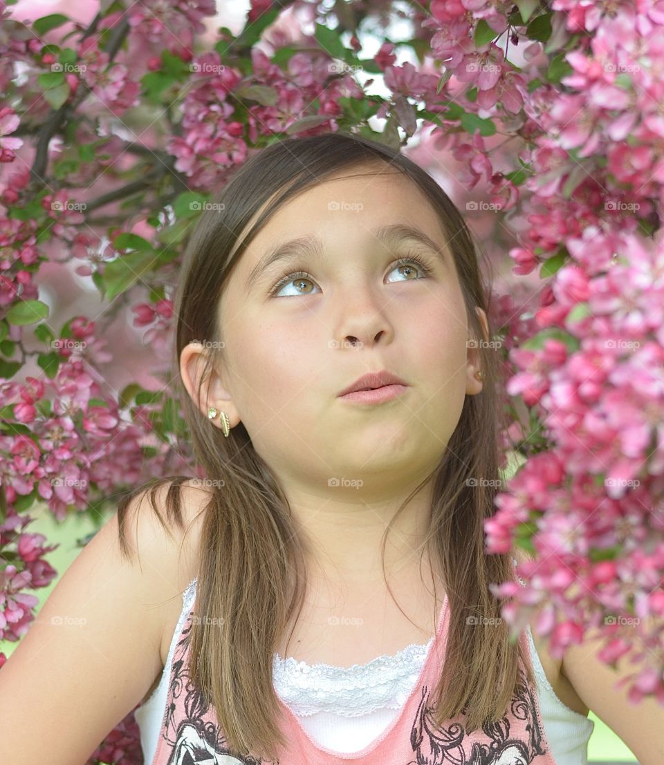 Portrait of small girl with flowers