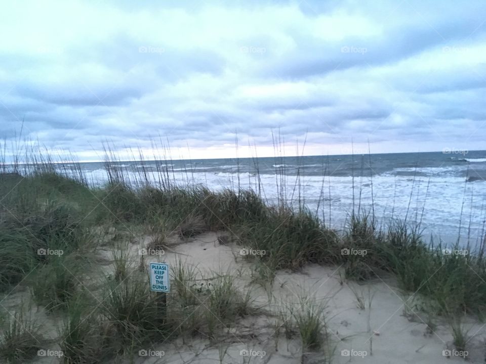 Ocean past sand dunes