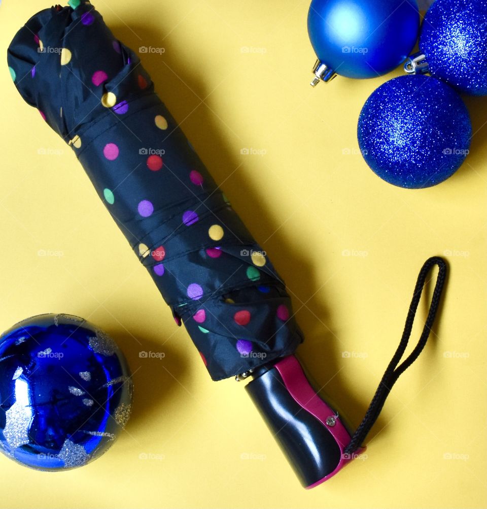 Totes umbrella in a colorful Christmas flat lay still life 