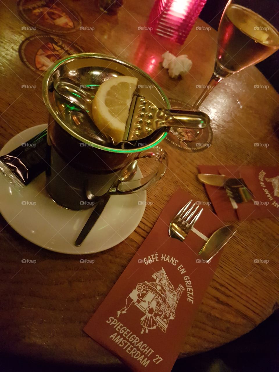 Hans and Grietje Cafe restaurant in Amsterdam, Holland, Europe, with tea and lemon in cup and saucer on table