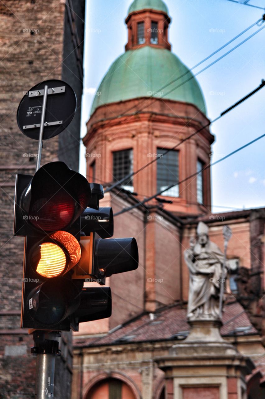 Yellow traffic light in the city Bologna 