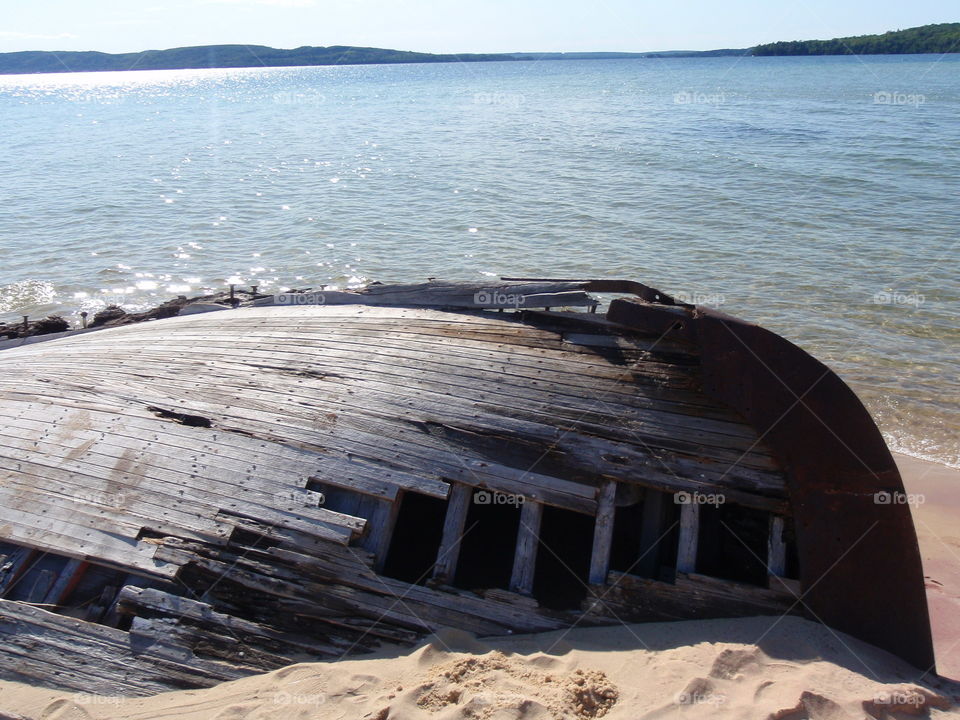 Munising Bay boat. Old wrecked boat on the beach in Munising Bay