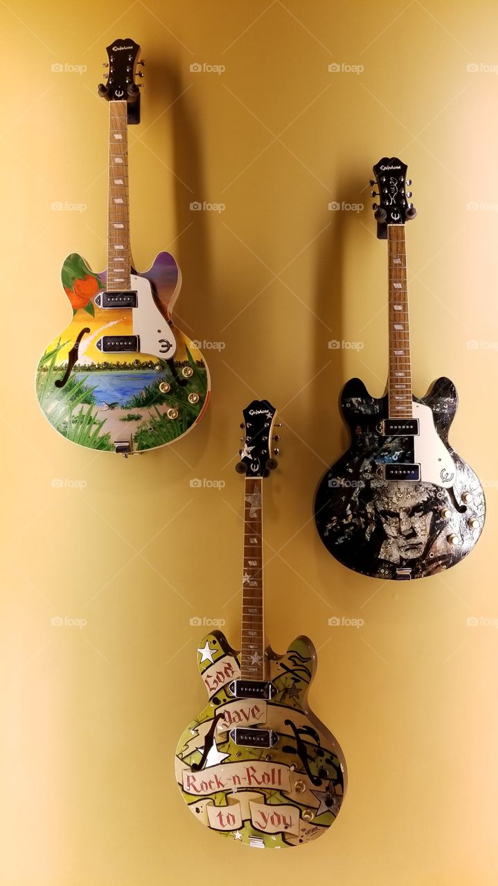 3 Guitars on Wall