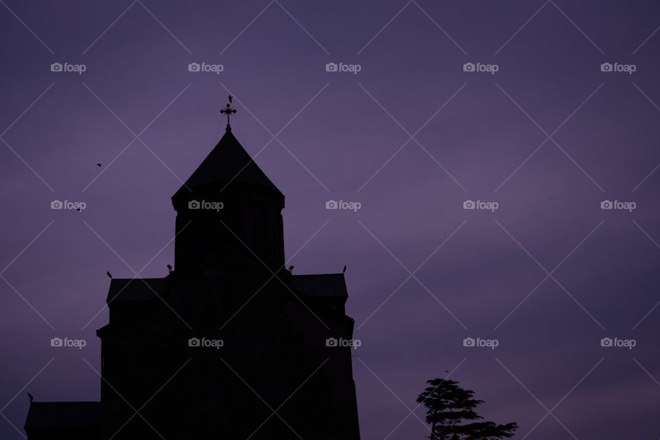 Halloween background, Shadow of church on violet sky