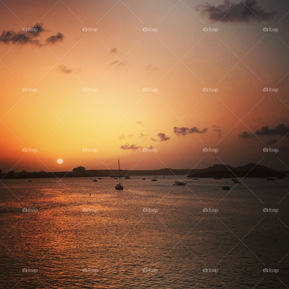 Sunset In St. Maarten, Boats On The Water While The Sunsets, Island Sunset, Red Glowing Sunset