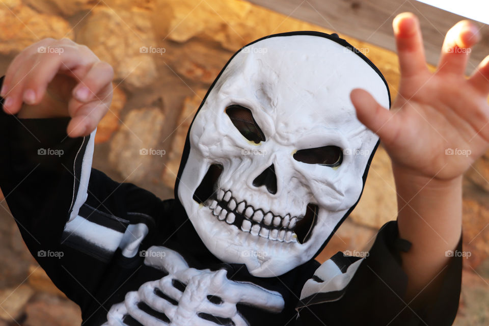 Child dressed as a skeleton for Halloween