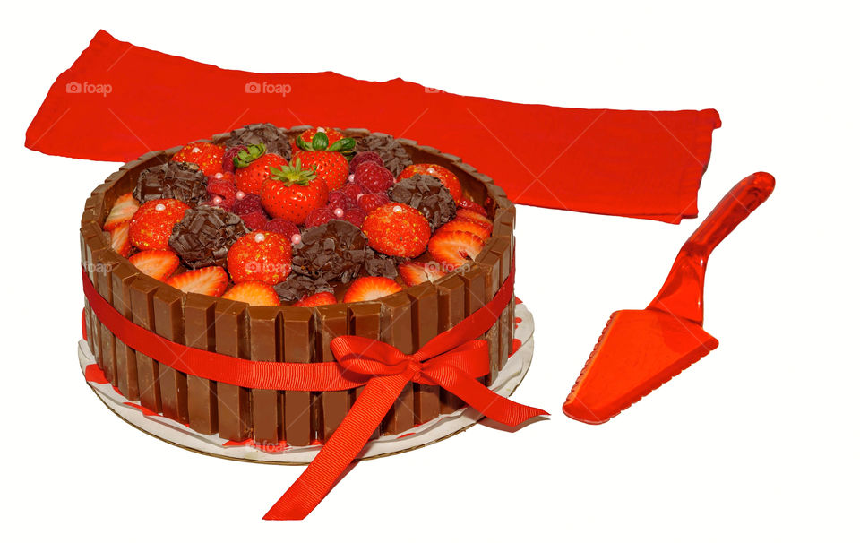 Chocolate cake with chocolate truffles, fruit and candy bars