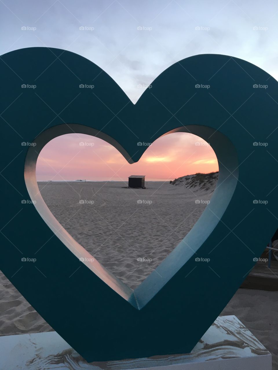 Love symbol on evening beach