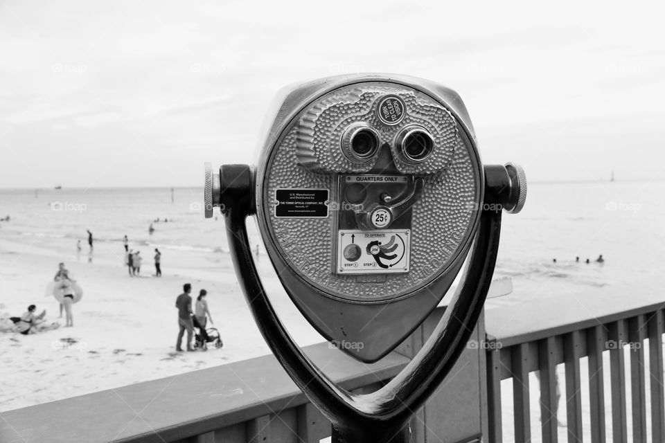 Tourist binoculars at the beach, black and white 