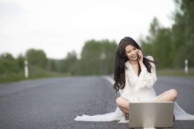 Woman on asphalt rural road