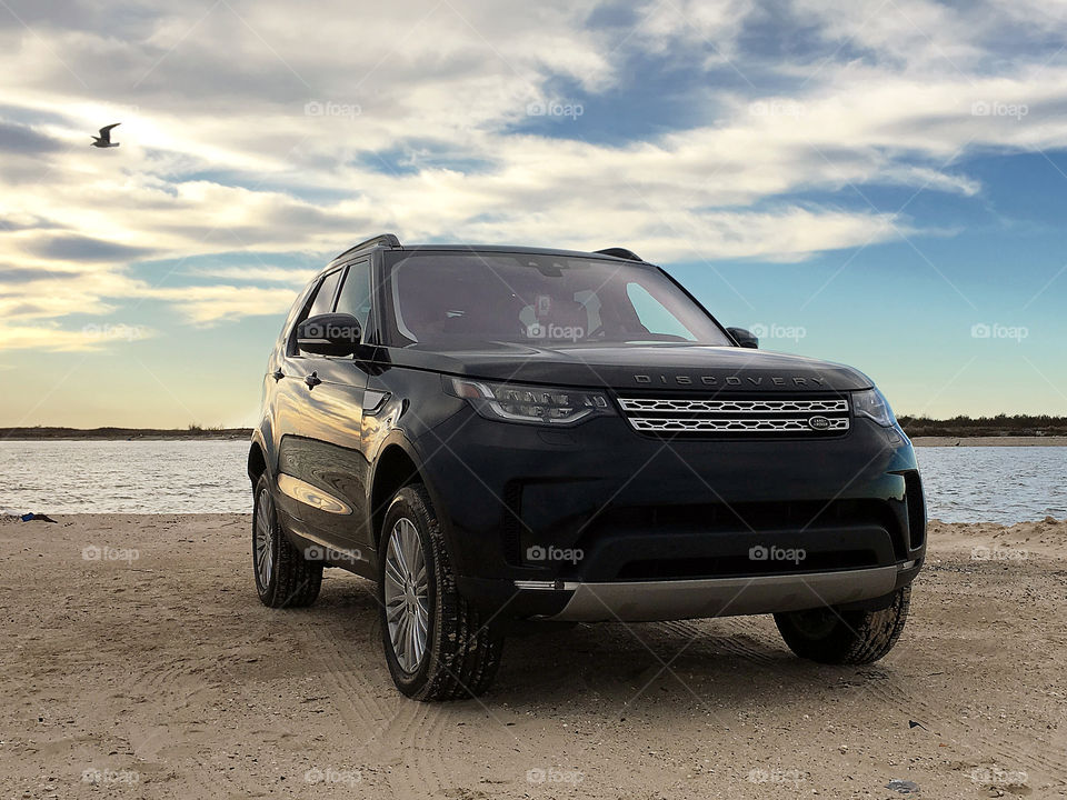 2017 land rover discovery hse on beach at sunset, offroading at jetty park, matagorda, texas