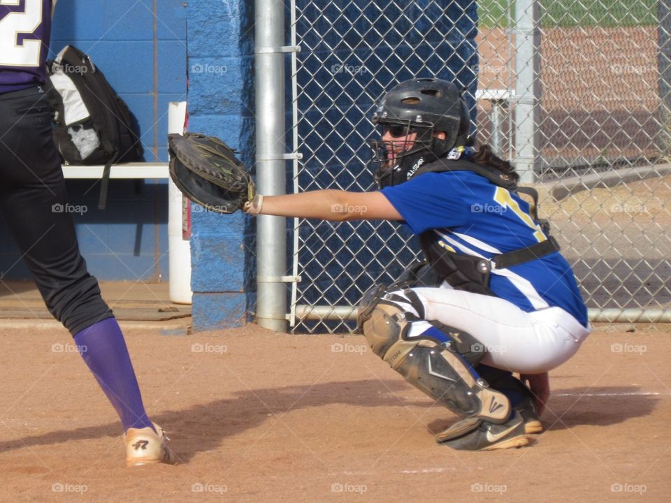 catcher. my daughter catching during a varsity softball game