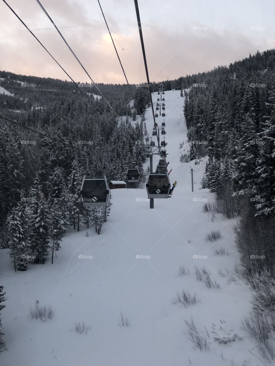 Beautiful morning gondola rides to work after a beautiful powder day in Vail, Colorado with colorful skies.