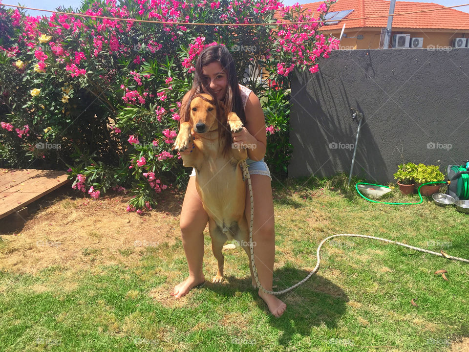 Happy teenage girl with her dog