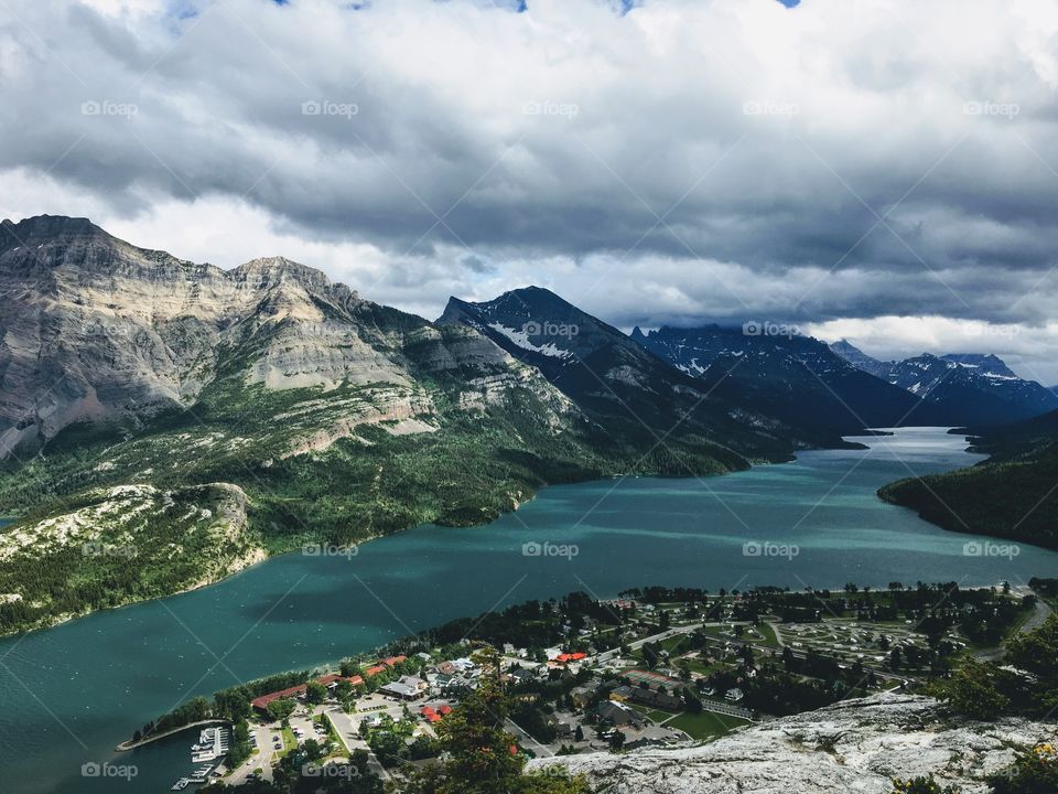 A look above on the town of Waterton on a dark cloudy day, at the top of bear's hump trail in Waterton Lakes National Park, Alberta, Canada