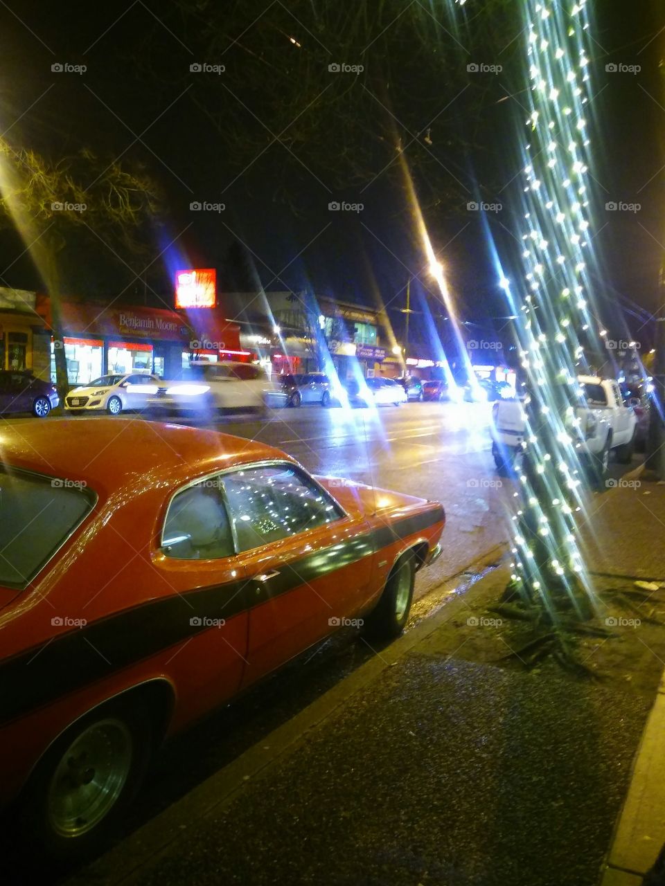 evenings street ligths red car