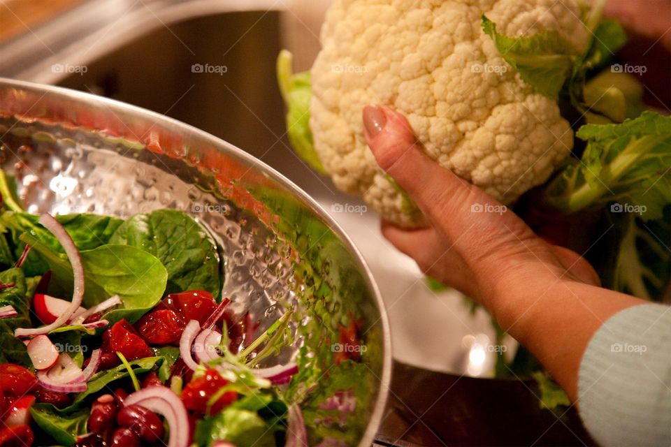 Close-up of woman holding cauliflower