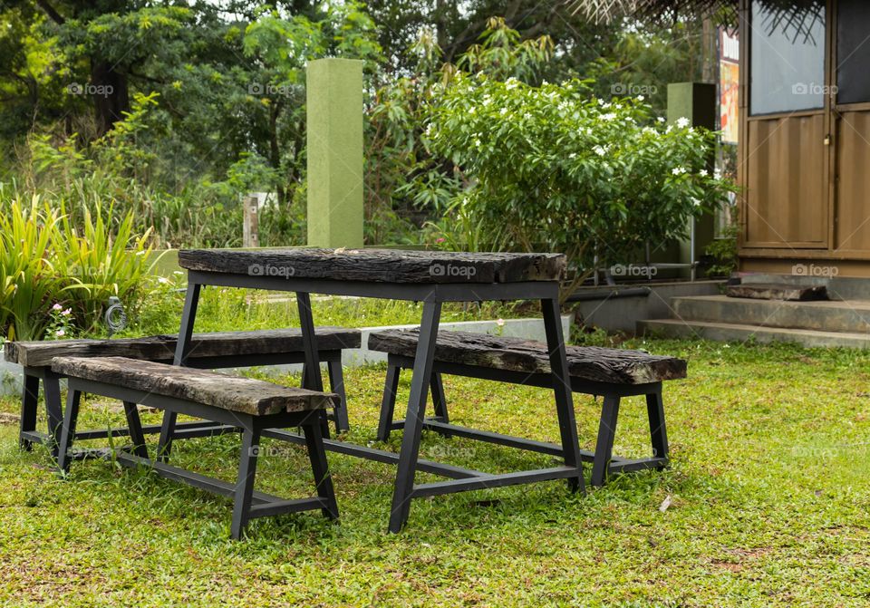 Ourdoor bench made of metal and wood. Iron structured and finished with wood.