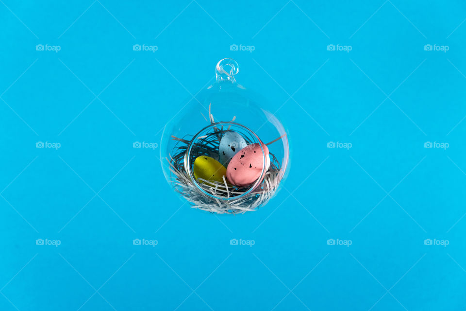Easter eggs in floatin glass nest