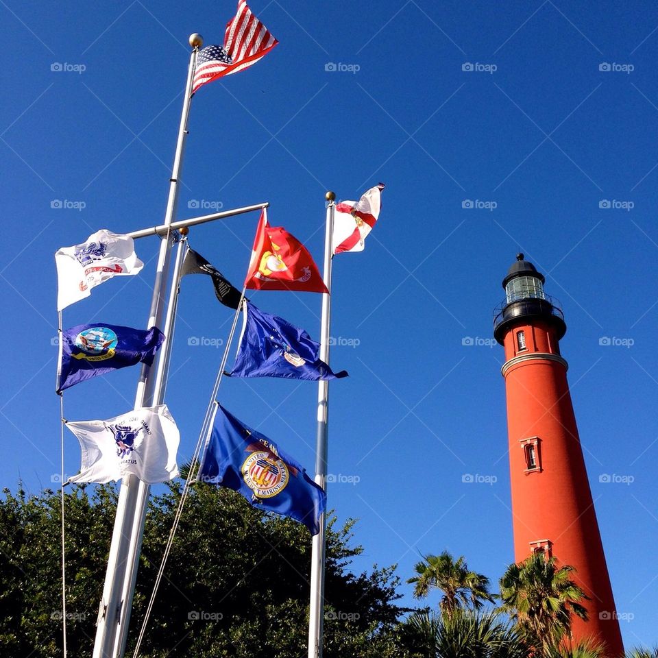 Flags to proudly support our military in front of the lighthouse. 