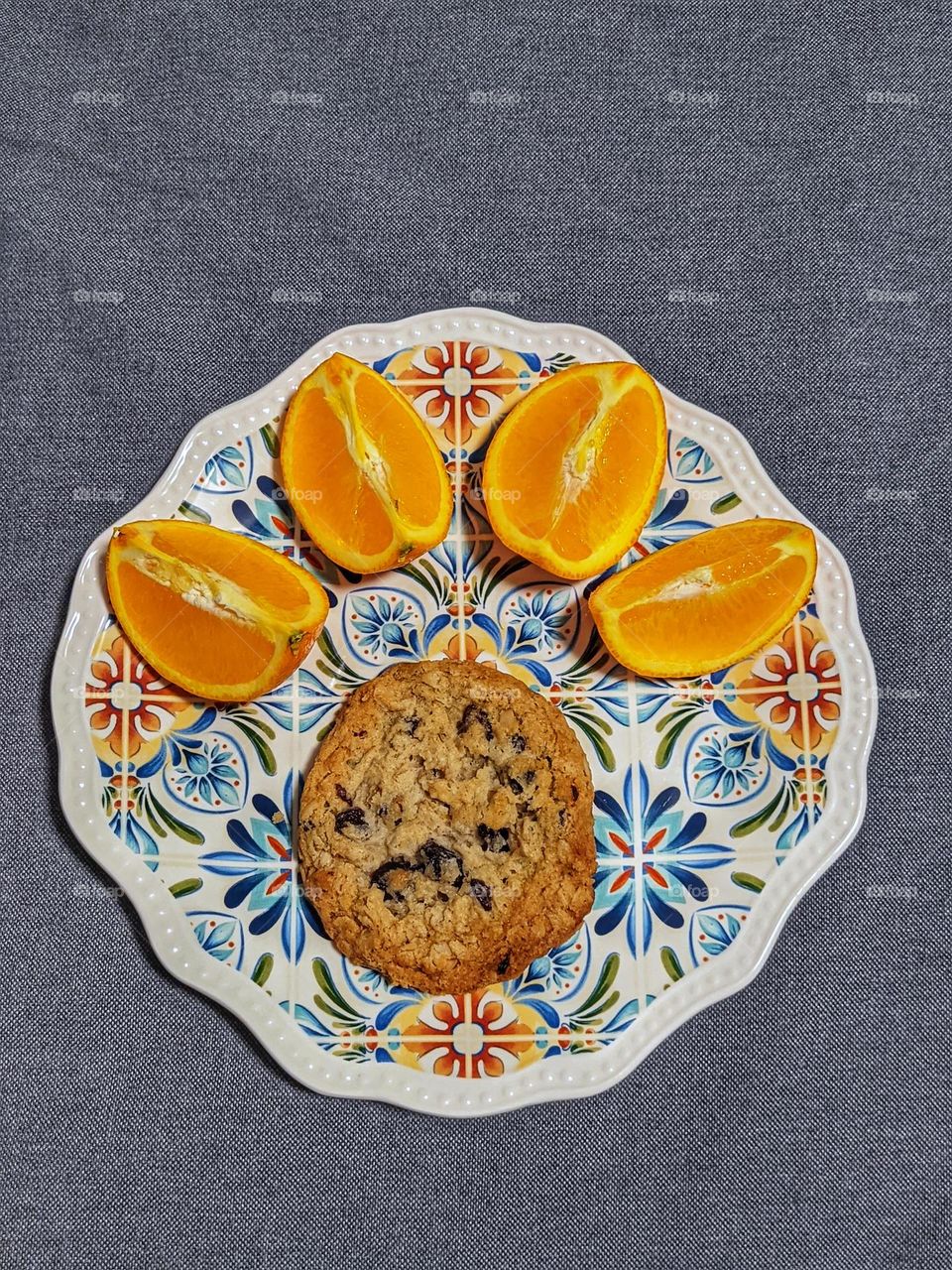 Top view of beautiful plate with cookies and oranges close up. breakfast concept.