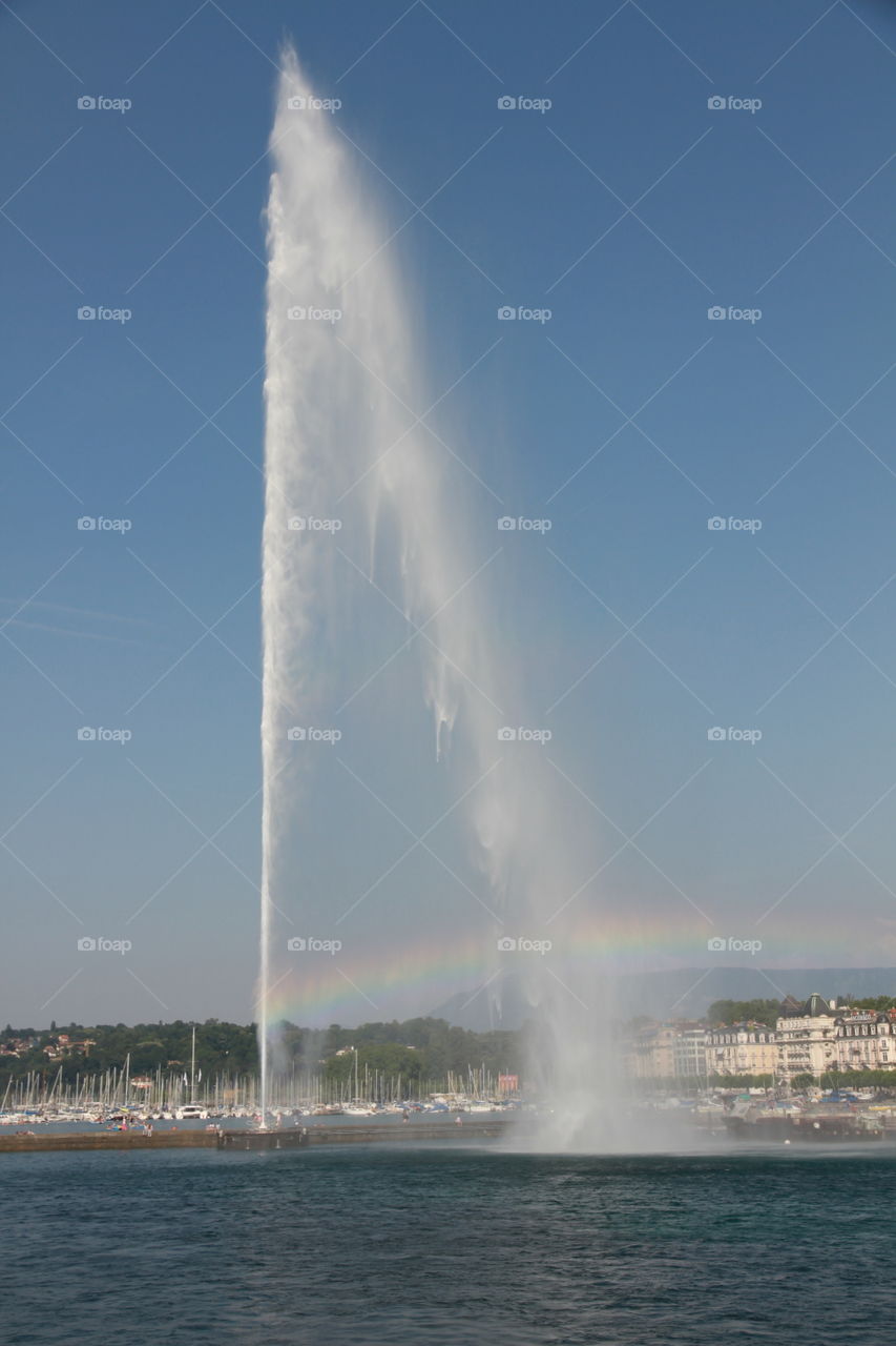 Rainbows in Geneva. Water jet in Geneva harbour 
