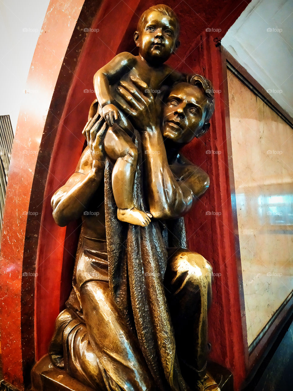 Moscow subway.  "Revolution square".  Man and child