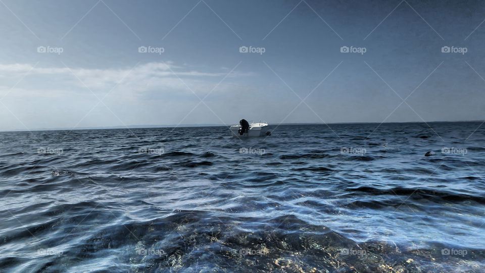 Boat on the big blue sea