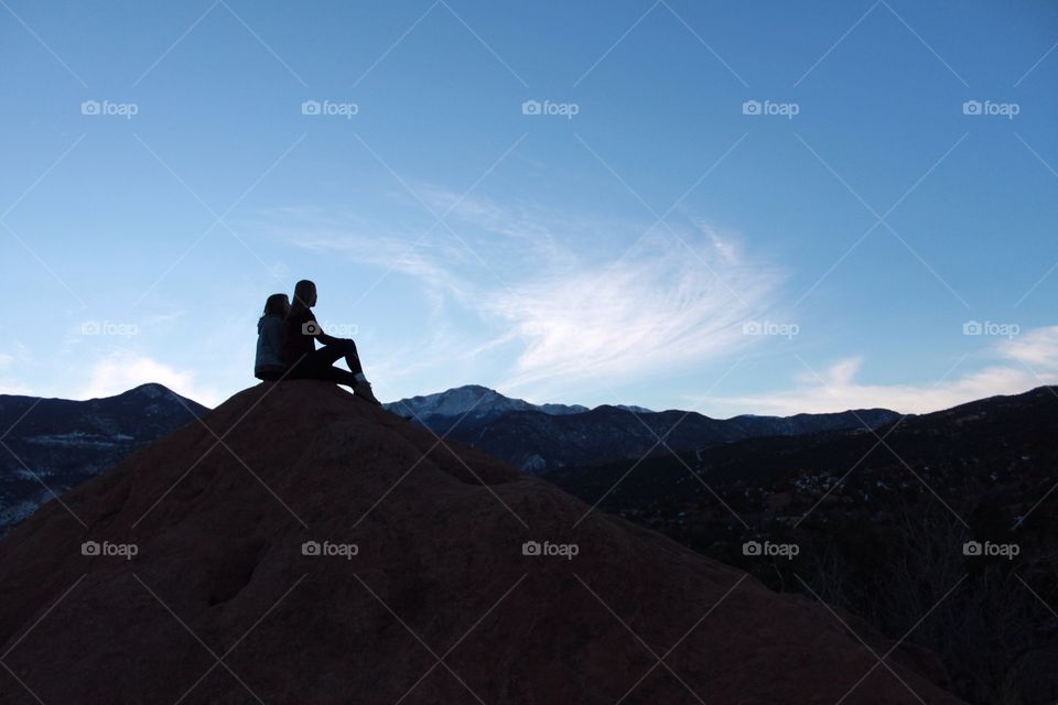 Silhouettes on a mountain top