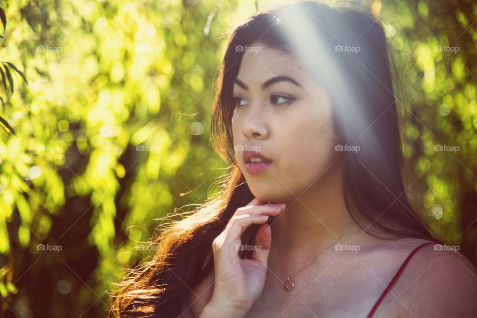 A young woman and gorgeous light rays