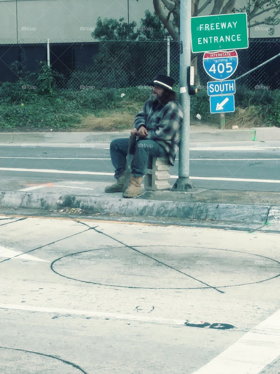 Homeless man by highway