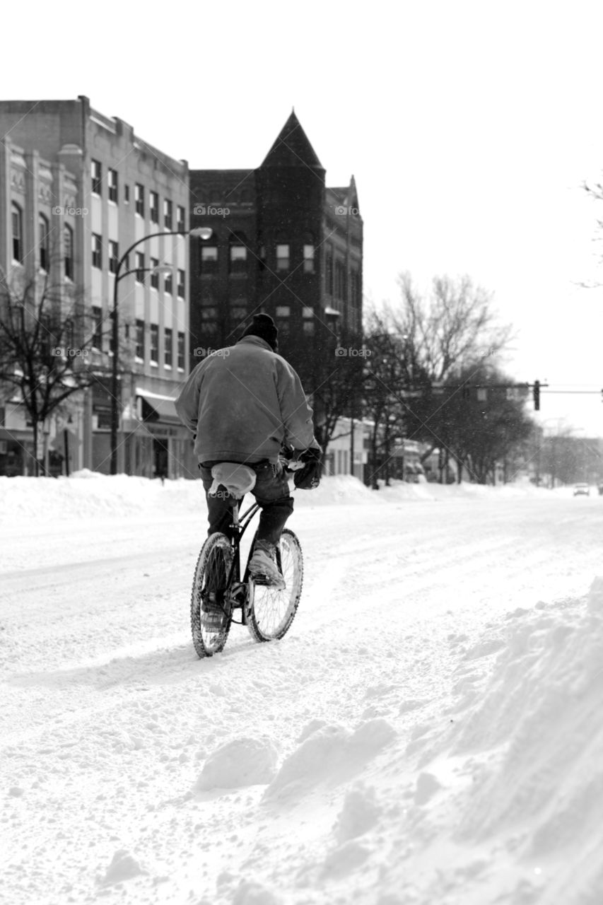 Person cycling in snow