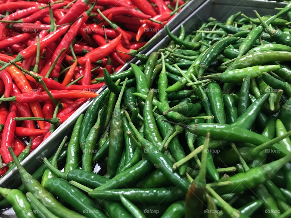 Red and green chillies in the supermarket