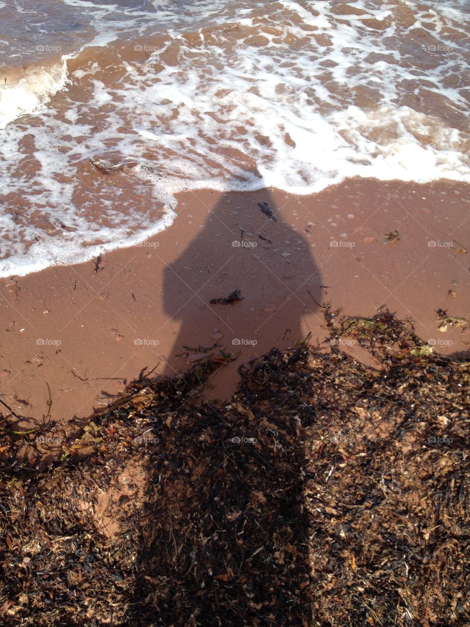 Standing on the beach in the morning with my shadow