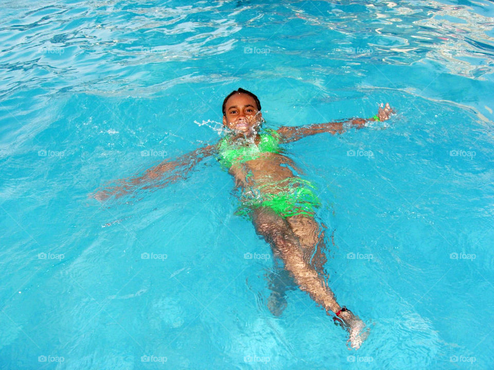 Girl swimming backwards