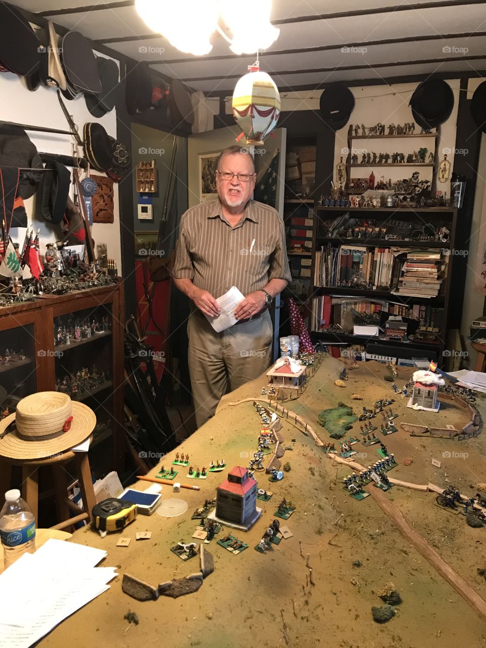 At home in his personal wargaming room. Surrounded by an immense collection of militaria items.