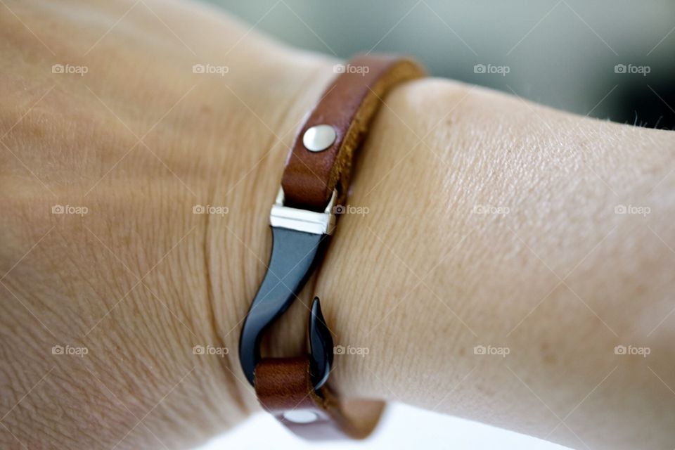Model Wearing Leather Metal Clasp Bracelet 