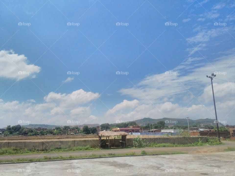 With the clouds open under the blue sky, my beloved village.