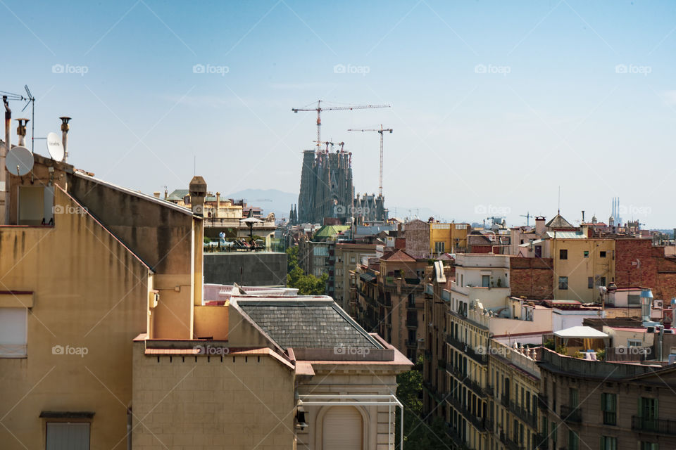 The mighty Sagrada Familia by Antoni Gaudi.

Behind trees, reflected in the streams and in the foreground is always a majestic architecture.