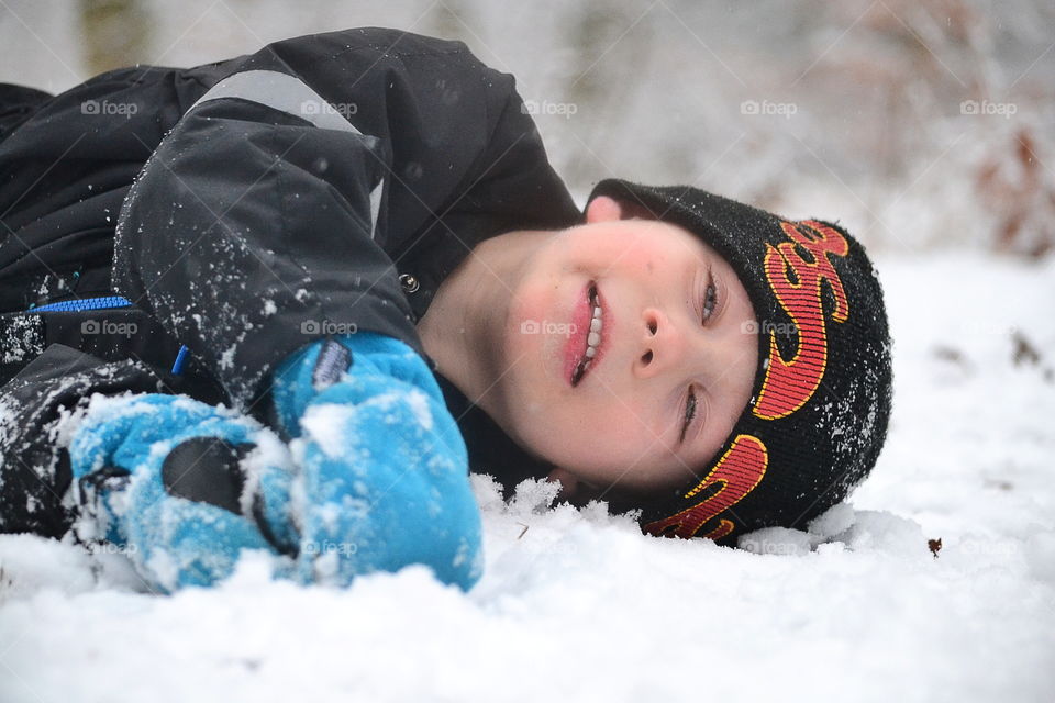 Boy playing in the snow