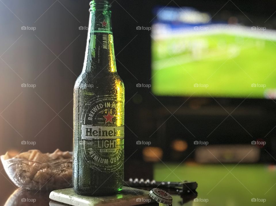 Heineken beer, soccer and a snack