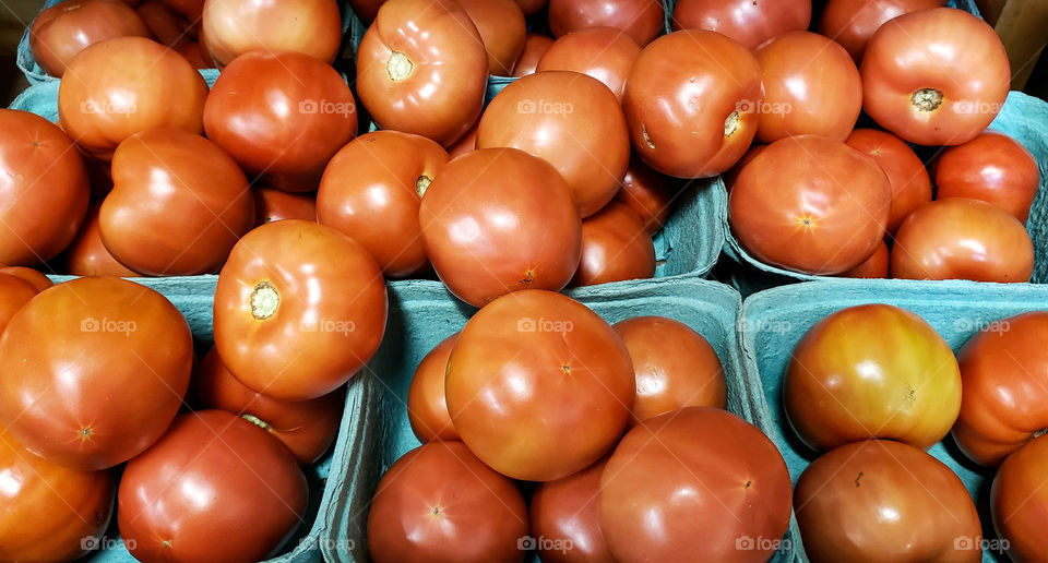 Tomatoes on display for sale.