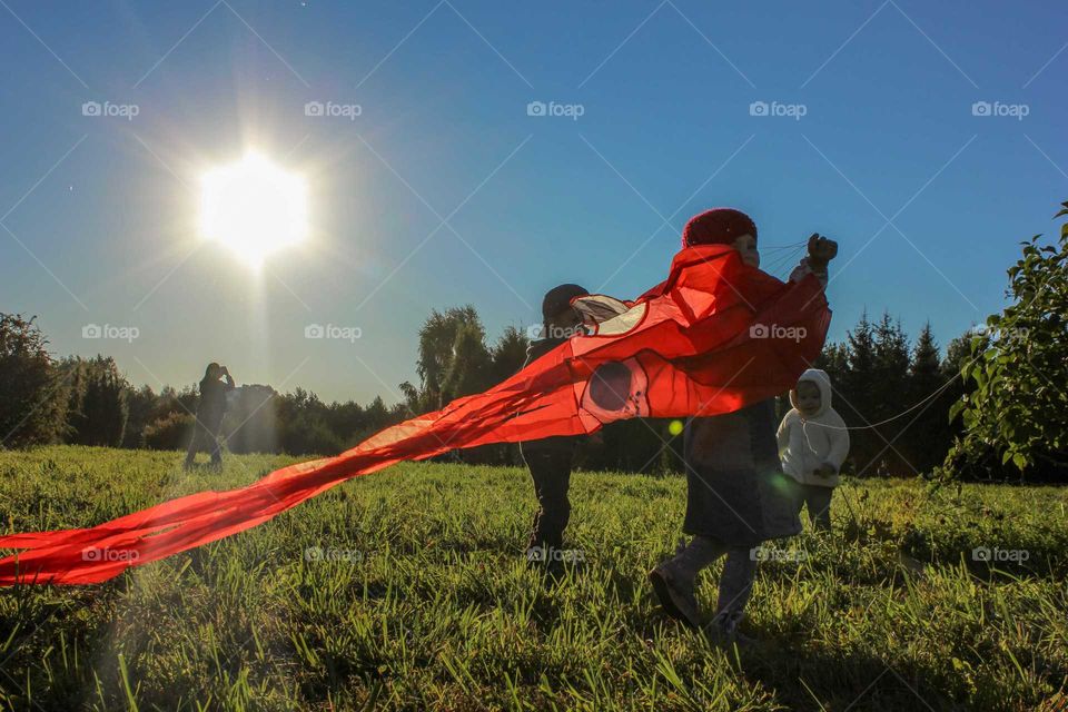 Children flying a kite.