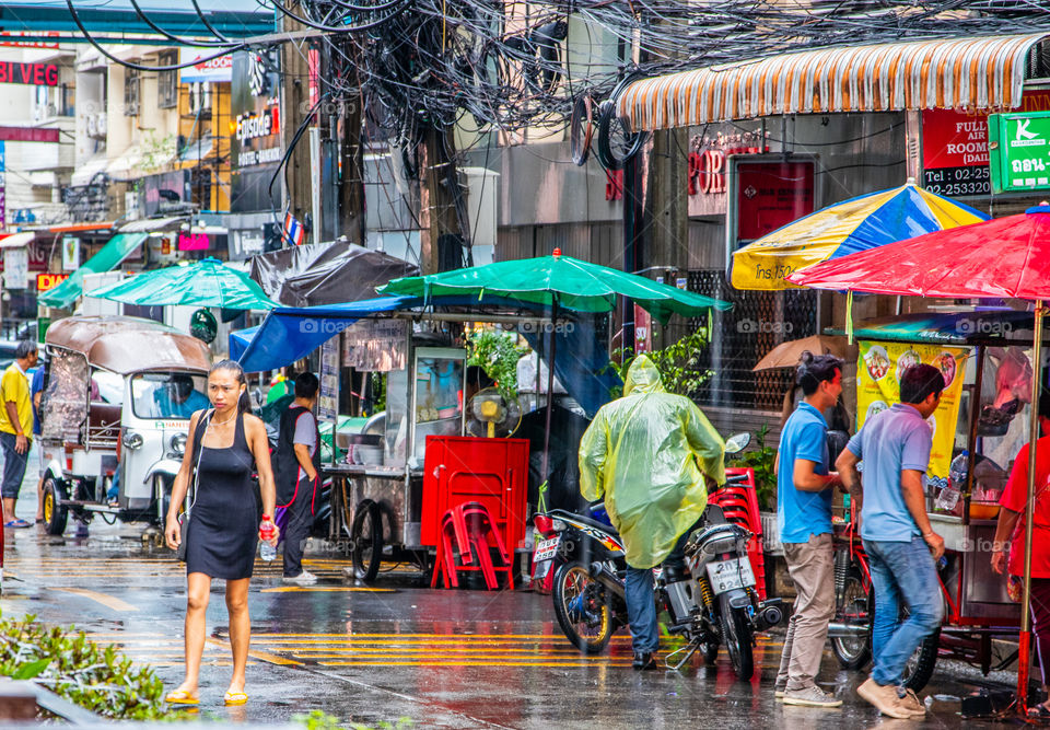 A big Rainshower in the Streets of the Metropolis City Bangkok Thailand Southeast Asia