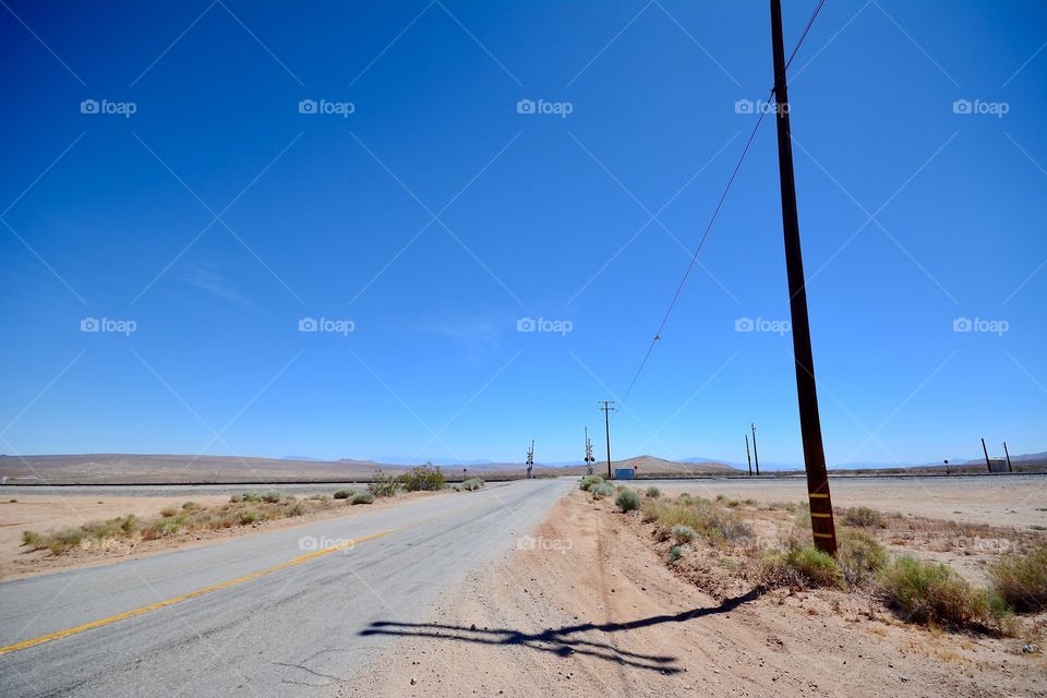 Dusty roads and railroad tracks on the way to Death Valley in California 