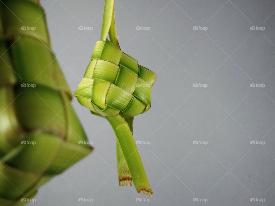 ketupat,  made from woven coconut leaves. filled with rice before cooking. Indonesian traditional food